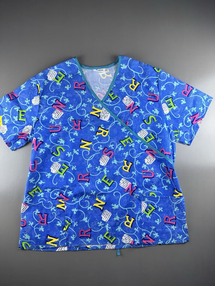 Fashion Scrubs Women’s Mock Wrap Scrub Top 3XL Scattered Nurse Letters Plus Size