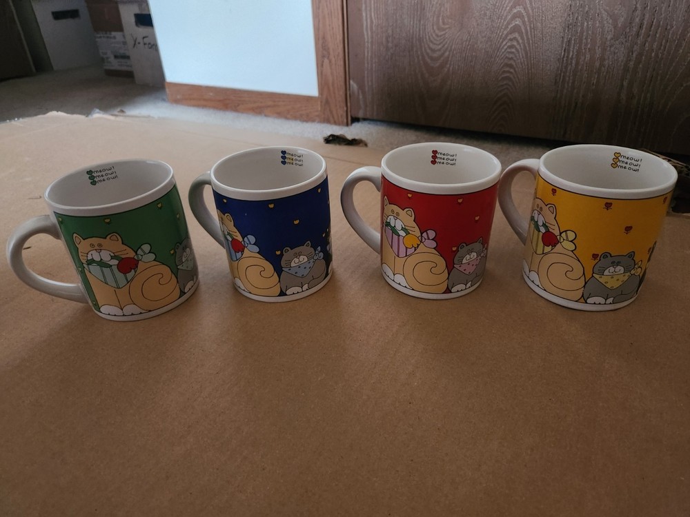 Set of 4 coffee mugs with cat designs(meow!)