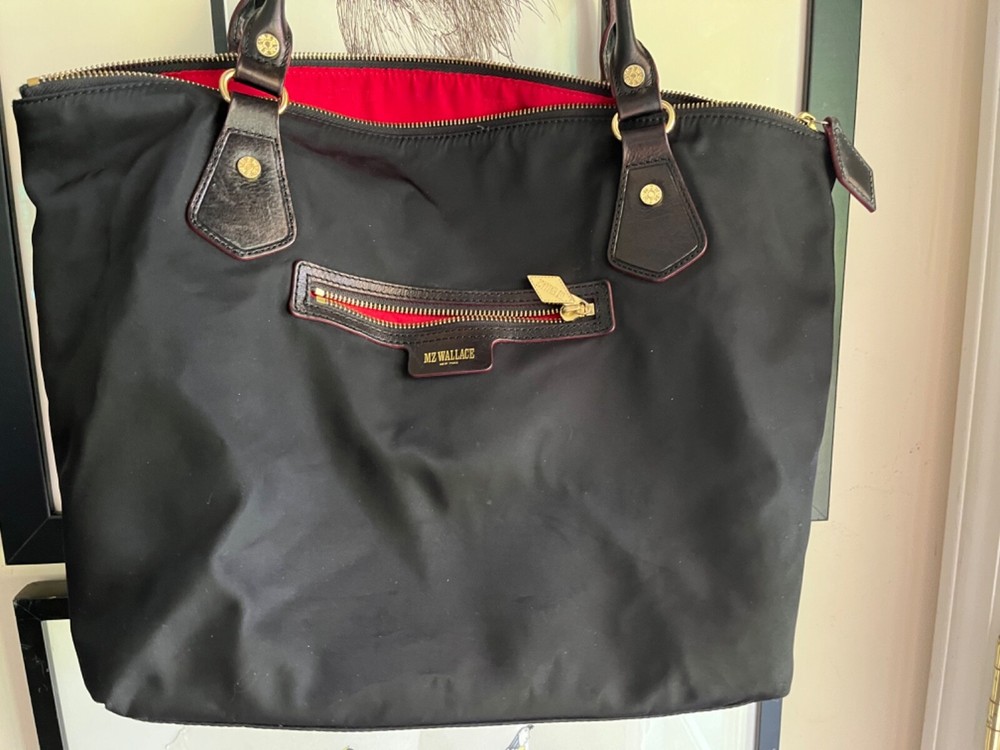 MZ Wallace black nylon leather handbag with red lining and gold hardware shoulder or hand carry