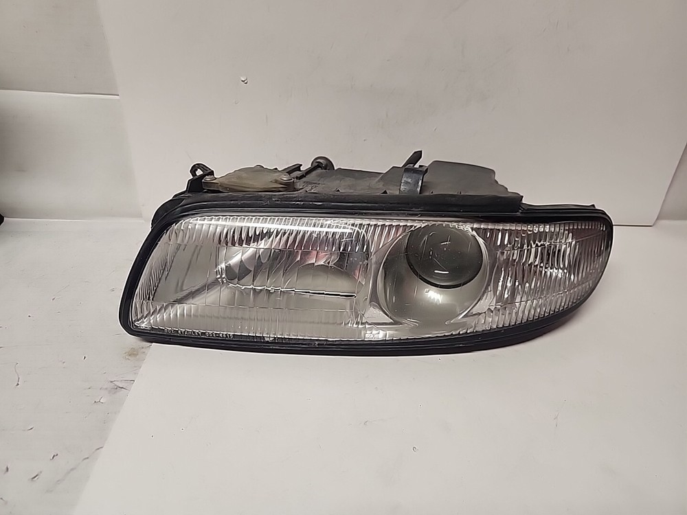 1995-1996 Mazda Millenia Driver Side Left OEM Headlight Assembly L104