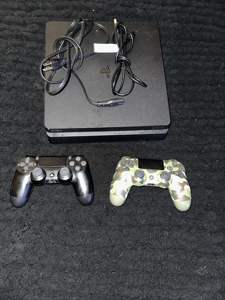 Pre-Owned PS4 Slim Console with Dual Controllers, Ready for Gaming Action